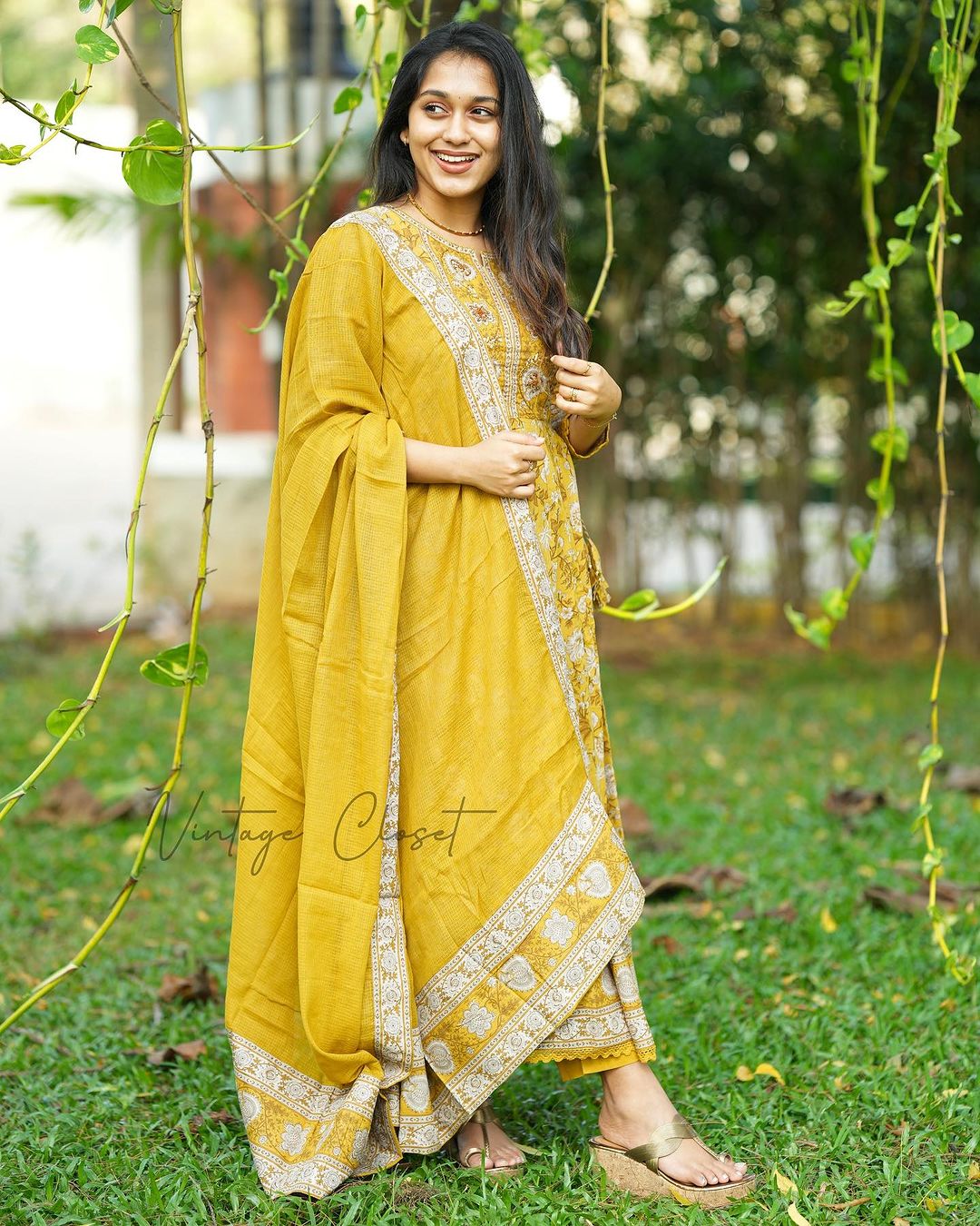 YELLOW VOLUMINOUS ANARKALI SUIT SET