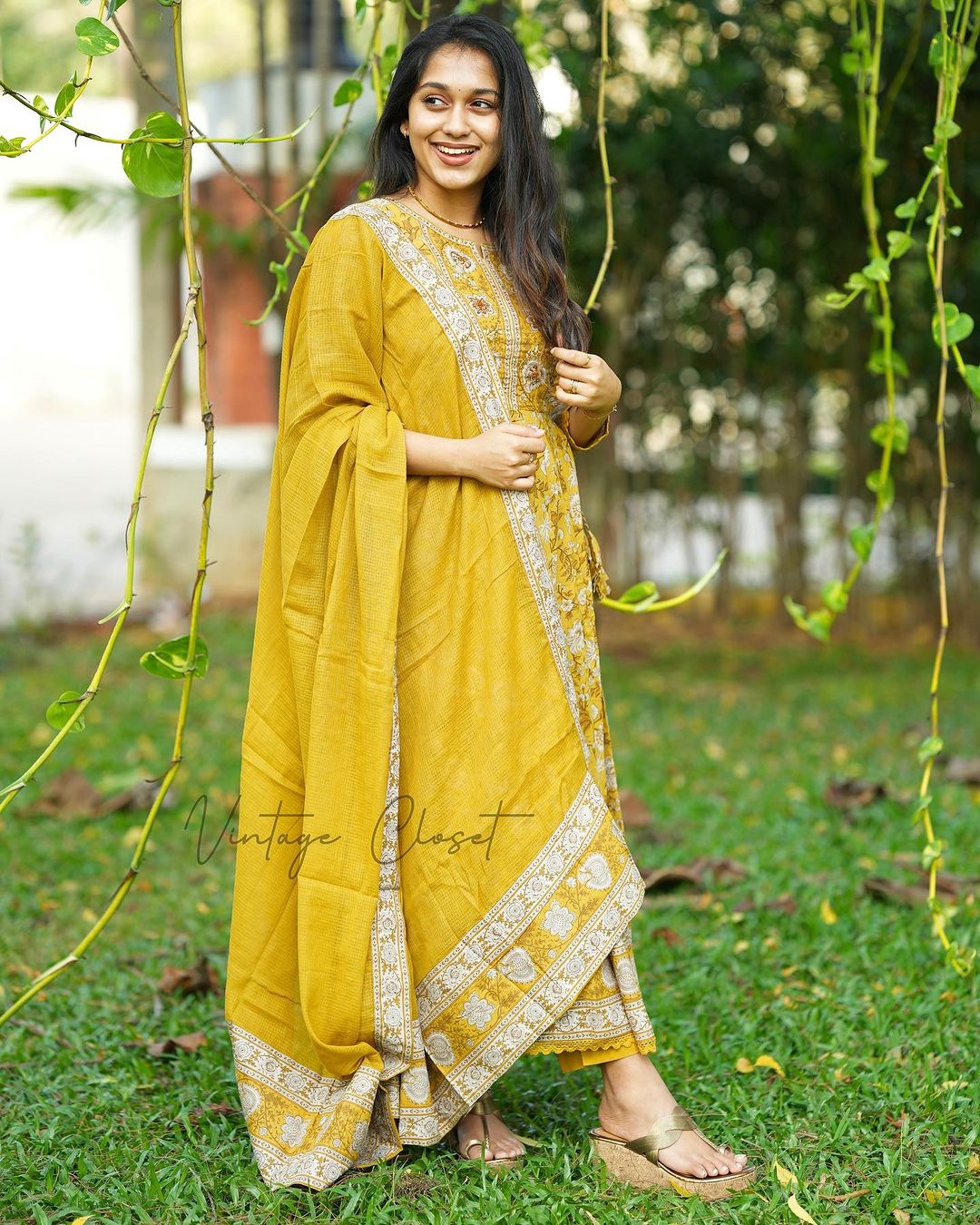 YELLOW VOLUMINOUS ANARKALI SUIT SET